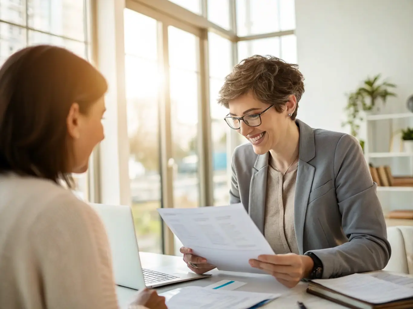 A professional accountant reviewing financial statements with a client in a modern office setting, emphasizing the expertise and personalized service.